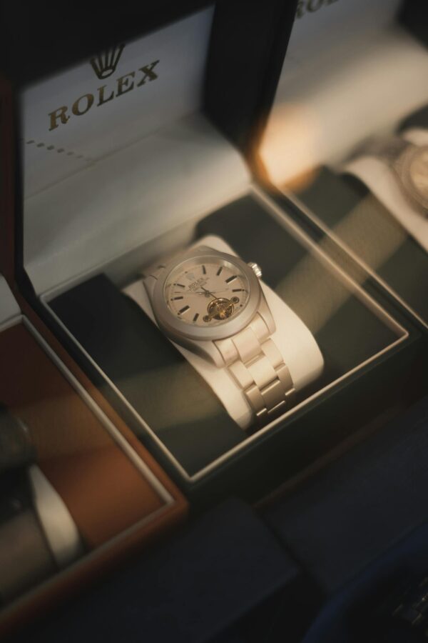 Rolex Watch in Box behind Glass